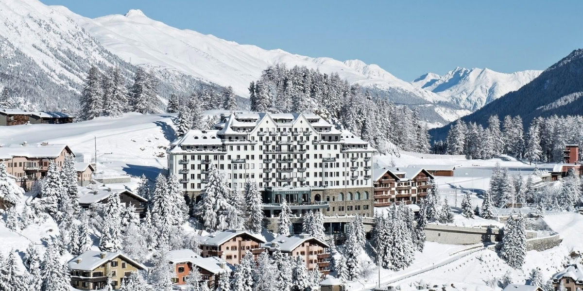 Premium SUV ski transfer arriving at St. Moritz hotel