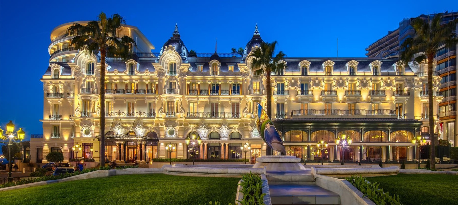 Illuminated luxury hotel facade in Monte-Carlo at night